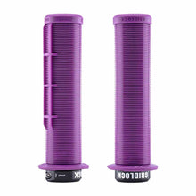 Load image into Gallery viewer, Two purple DMR Gridlock bicycle handlebar grips with 'Gridlock' branding on a white background